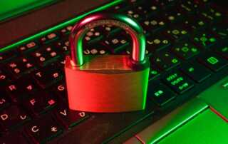 red padlock on black computer keyboard